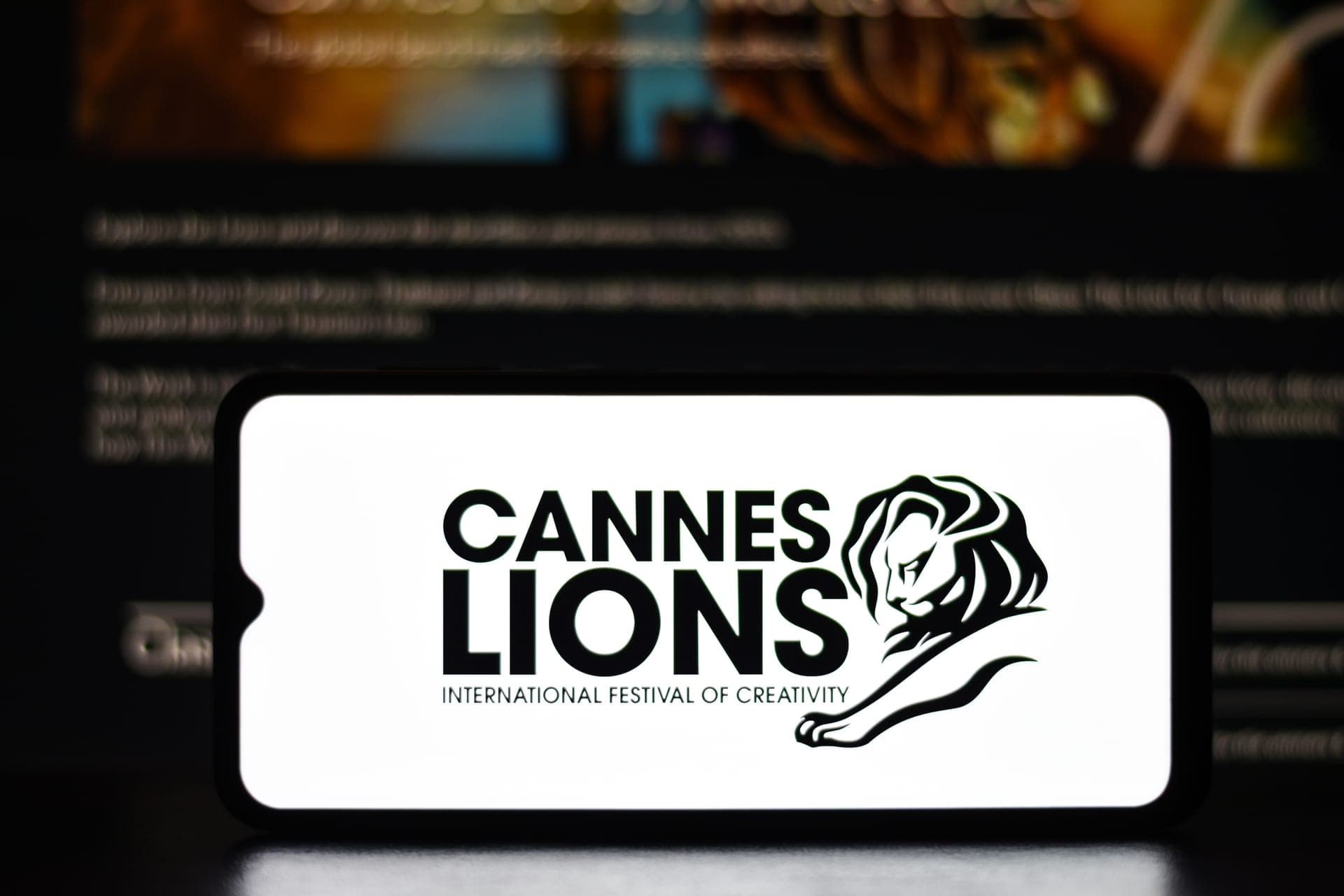 A smartphone displaying the Cannes Lions International Festival of Creativity logo